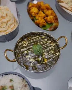 Assorted curries, dal, naan and pakoras served at Meghna Grill, Indian restaurant in St John's Wood NW8